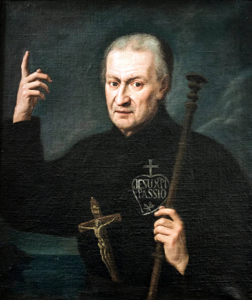 San Pablo de la Cruz con el crucifijo y el emblema pasionista